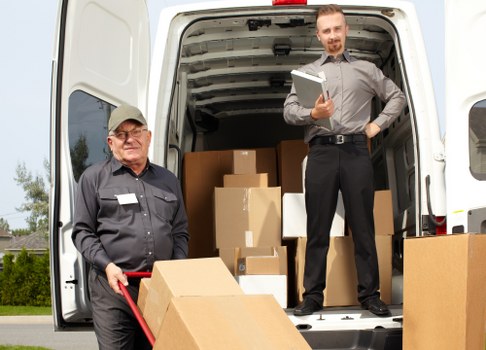 Removal van and moving team in a Cardiff residential street