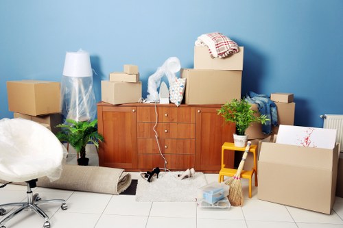 Removal team preparing boxes and furniture for a Cardiff home move