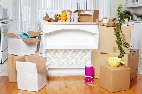 Removal team handling household items in a Cardiff apartment building