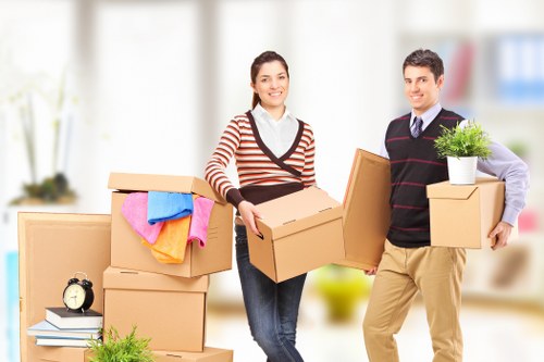 Professional movers handling furniture in a Cardiff property