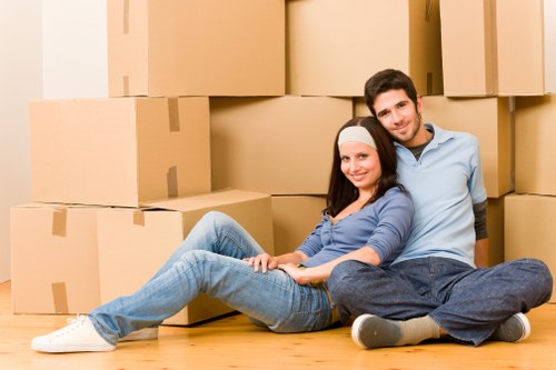Cardiff moving team organising packed boxes in a property
