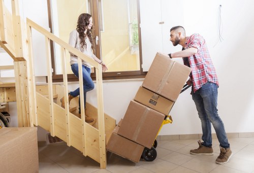 Workers reviewing health and safety procedures for a removal