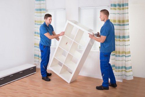 Removal van loading furniture for a flat move in Cardiff