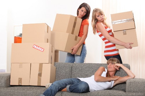 House removalists navigating stairs in a Cardiff property