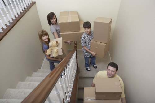 Moving team handling boxes in a Cardiff residential street